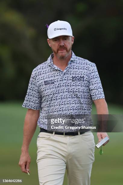 Jimmy Walker of the United States walks onto the tenth green during the second round of the Sony Open in Hawaii at Waialae Country Club on January...