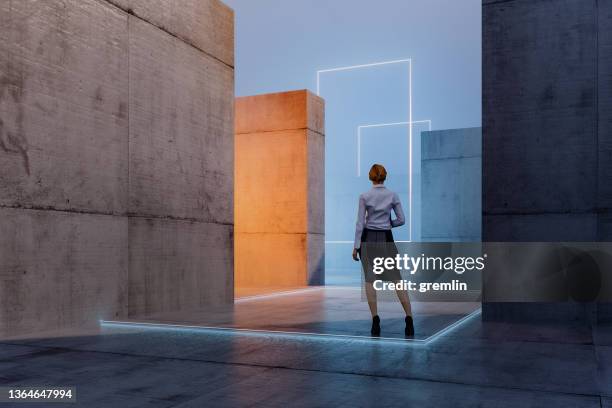 lost businesswoman standing in concrete maze - boundary stock pictures, royalty-free photos & images