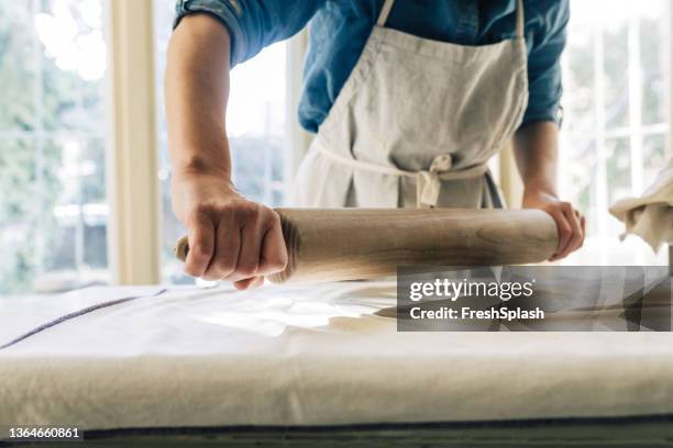 anonymous woman artisan manufacturing ceramic object - rolling pin stock pictures, royalty-free photos & images