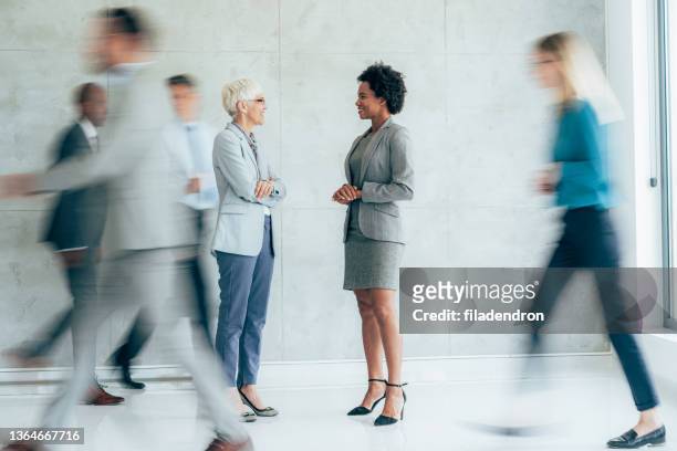 busy business - business talk stock pictures, royalty-free photos & images