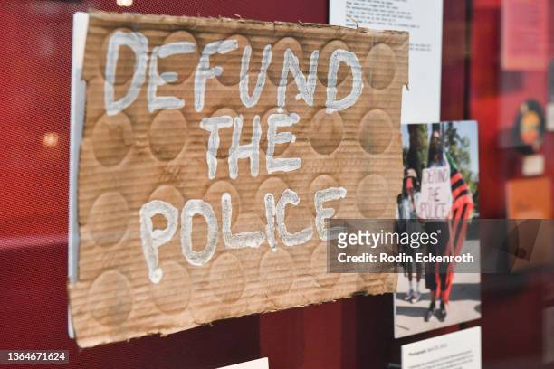 Defund the Police" protest sign on display at the "Songs of Conscience Sounds of Freedom" press preview at The GRAMMY Museum on January 14, 2022 in...