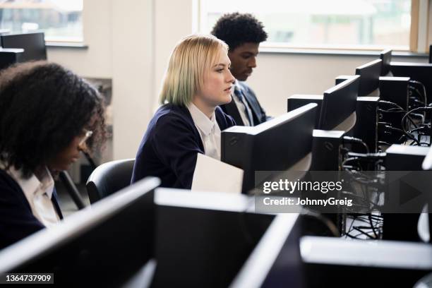 male and female students working in school computer lab - computer training stock pictures, royalty-free photos & images