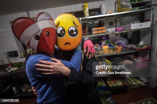 Activists and homeless people, protecting their identities and privacy from the cameras by wearing emoji masks created by the french artist Ombeline...