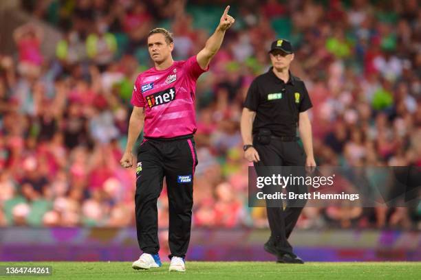 Stephen O'Keefe of the Sixers celebrates after taking the wicket of Daniel Sams of the Thunder during the Men's Big Bash League match between the...