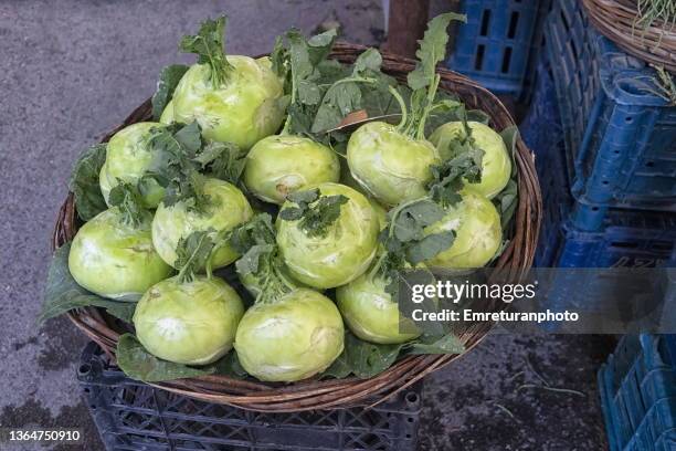 kohlrabi for sale in a basket in the market. - emreturanphoto stock pictures, royalty-free photos & images