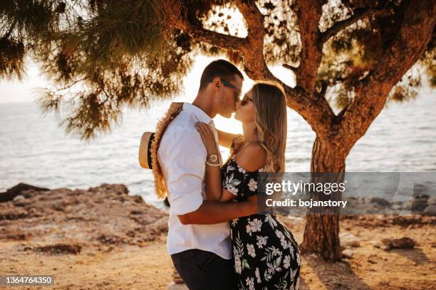 summertime is time for love - young couple on beach stock pictures, royalty-free photos & images