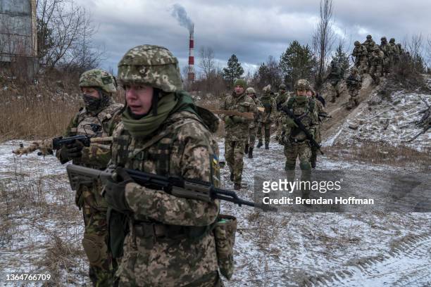 Members of the Kyiv Territorial Defense Unit are trained in an industrial area on January 15, 2022 in Kyiv, Ukraine. As worries of a Russian invasion...