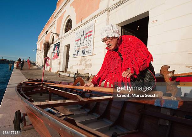 Gianni Colombo called "timbro" prepares his boat ahead of the 34th Befana Regata on January 6, 2012 in Venice, Italy. In Italian folklore, Befana is...