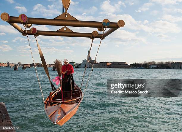 Rover stands on his boat while is launhed in the lagoon ahead of the 34th Befana Regata on January 6, 2012 in Venice, Italy. In Italian folklore,...