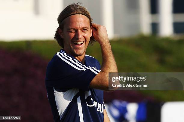 Goalkeeper Timo Hildebrand laughs during a training session of Schalke 04 at the ASPIRE Academy for Sports Excellence on January 6, 2012 in Doha,...