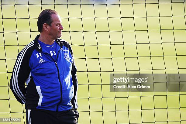 Head coach Huub Stevens looks on during a training session of Schalke 04 at the ASPIRE Academy for Sports Excellence on January 6, 2012 in Doha,...