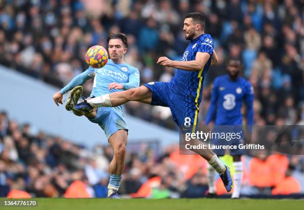 Jack Grealish of Manchester City is tackled by Mateo Kovacic of Chelsea during the Premier League match between Manchester City and Chelsea at Etihad...