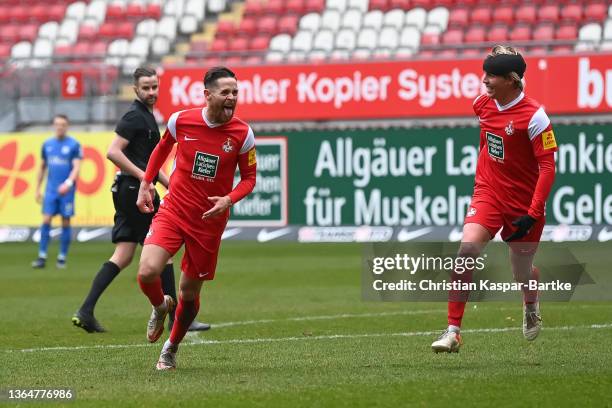 Mike Wunderlich of 1.FC Kaiserslautern celebrates after scoring his team`s fourth goal with teammate Felix Goetze of 1.FC Kaiserslautern during the...