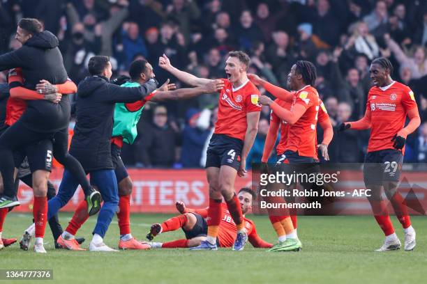 Kal Naismith of Luton Town leads wild celebrations after he scores a goal to make it 3-2 during the Sky Bet Championship match between Luton Town and...
