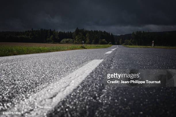 rainy weather, a road in moravia near brno, czech republic - brno czech republic stock pictures, royalty-free photos & images