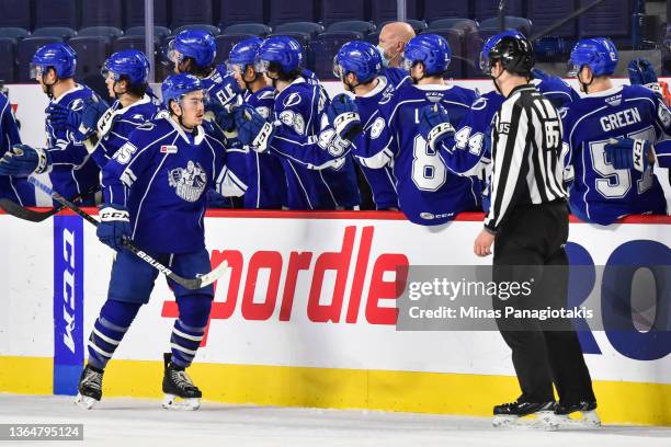 Charles Hudon of the Syracuse Crunch celebrates his goal with teammates during the second period against the Laval Rocket at Place Bell on January...