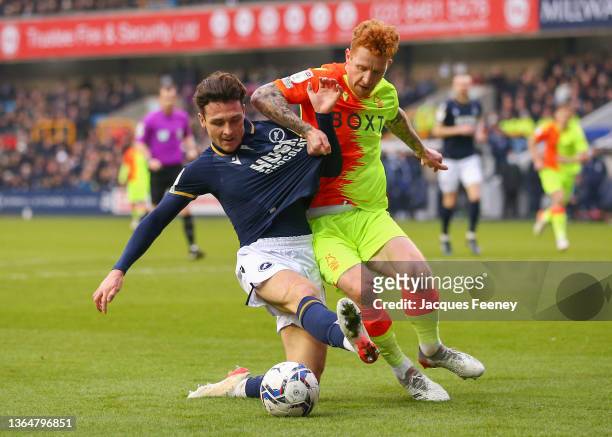 Dan McNamara of Millwall battles for possession with Jack Colback of Nottingham Forest during the Sky Bet Championship match between Millwall and...