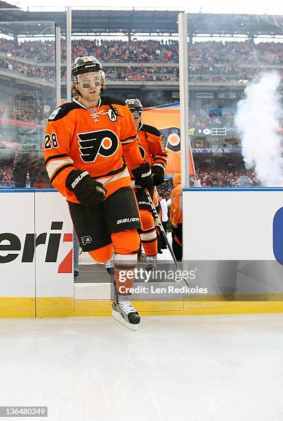 Claude Giroux of the Philadelphia Flyers enters the ice rink at the start of 2012 Bridgestone NHL Winter Classic against the New York Rangers on...