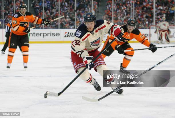 Anton Stralman of the New York Rangers skates the puck against the Philadelphia Flyers at the 2012 Bridgestone NHL Winter Classic on January 2, 2012...