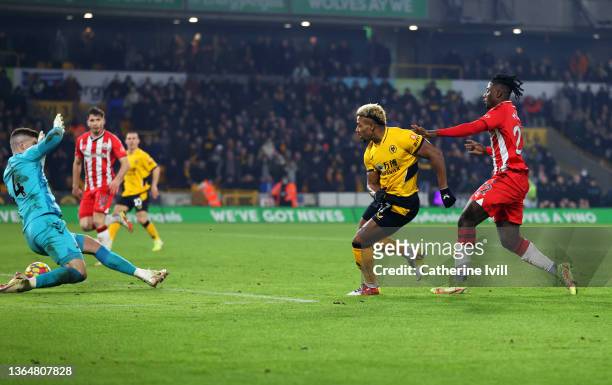 Adama Traore of Wolverhampton Wanderers scores their team's third goal during the Premier League match between Wolverhampton Wanderers and...