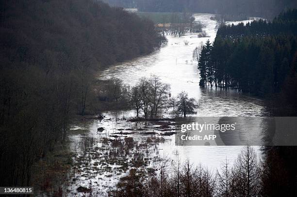 Picture taken Bouillon on January 6, 2012 shows the flooded Semois river. The Belgian Royal Meteorological Institute gave yesterday an orange code...