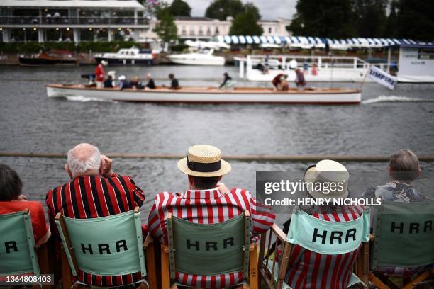 Spectators watch a race on the River Thames at the Henley Royal Regatta in Henley-on-Thames, west of London, on June 30, 2023.