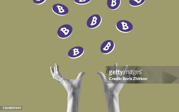human hands catching bitcoins. - catching money stock pictures, royalty-free photos & images