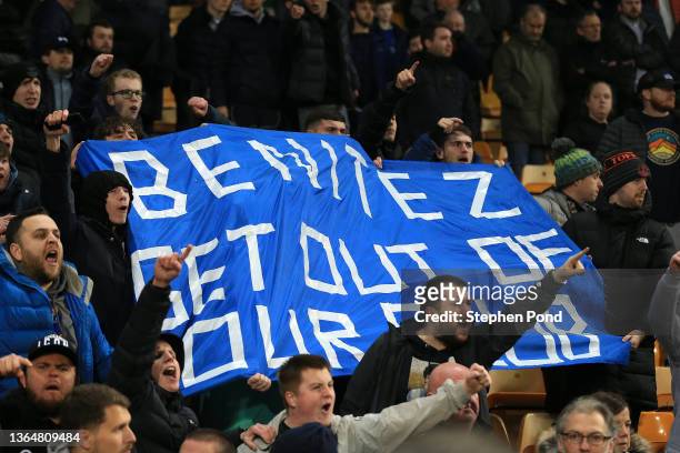Everton fans raise a banner referencing manager, Rafael Benitez during the Premier League match between Norwich City and Everton at Carrow Road on...