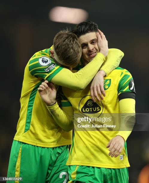 Brandon Williams of Norwich City celebrates with Milot Rashica following victory in the Premier League match between Norwich City and Everton at...