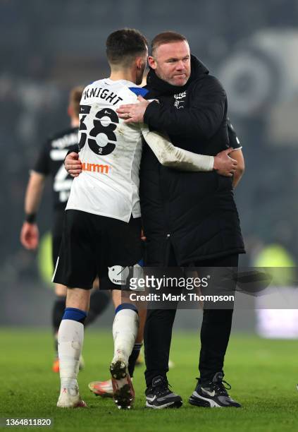Wayne Rooney embraces Jason Knight of Derby County after their sides victory during the Sky Bet Championship match between Derby County and Sheffield...