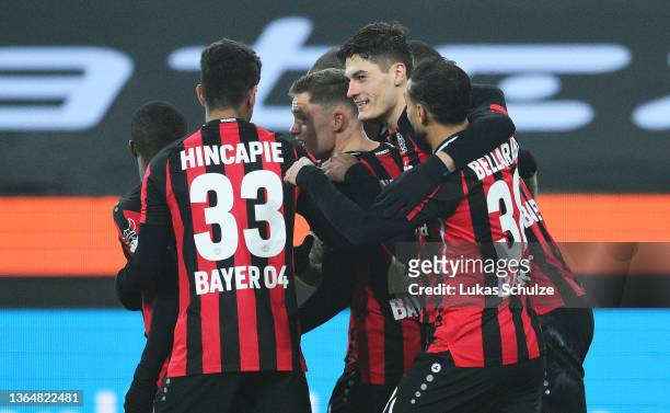 Robert Andrich of Bayer 04 Leverkusen celebrates with Patrik Schick and teammates after scoring their side's first goal during the Bundesliga match...