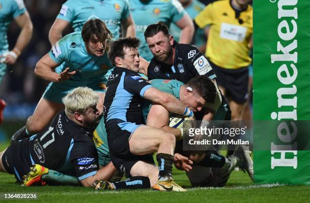Dave Ewers of Exeter Chiefs scores his side's eighth try as he is tackled by George Horne and Oli Kebble of Glasgow Warriors during the Heineken...