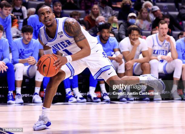 Paul Scruggs of the Xavier Musketeers keeps the ball inbounds during the second half against the Creighton Bluejays at Cintas Center on January 15,...