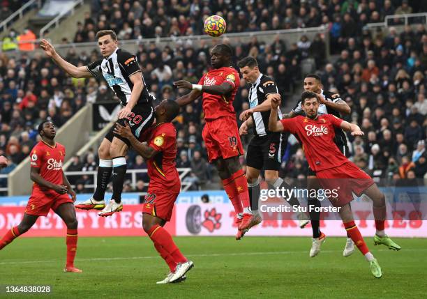 Newcastle striker Chris Wood (l0 goes up for a header on his debut during the Premier League match between Newcastle United and Watford at St. James...