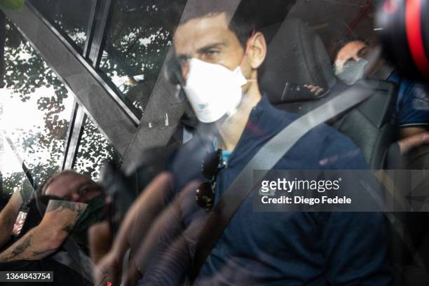 Serbian tennis player Novak Djokovic leaves the Park hotel on January 16, 2022 in Melbourne, Australia. Djokovic is in detention and faces...