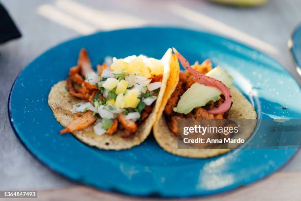 mexican tacos on a blue plate. - guanajuato stock pictures, royalty-free photos & images