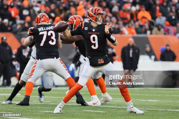 Quarterback Joe Burrow of the Cincinnati Bengals throws a first half pass against the Las Vegas Raiders during the AFC Wild Card playoff game at Paul...