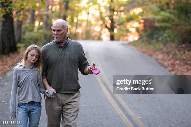 grandfather walking with granddaughter - sewanee fotografías e imágenes de stock