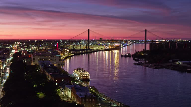 https://media.gettyimages.com/id/1364858543/video/talmadge-bridge-and-savannah-riverfront-at-dusk-aerial.jpg?b=1&s=640x640&k=20&c=LeBSi3Jj0FrIl8oVOdQdYp-WUgWoCyDZoDgpFbDE6h8=