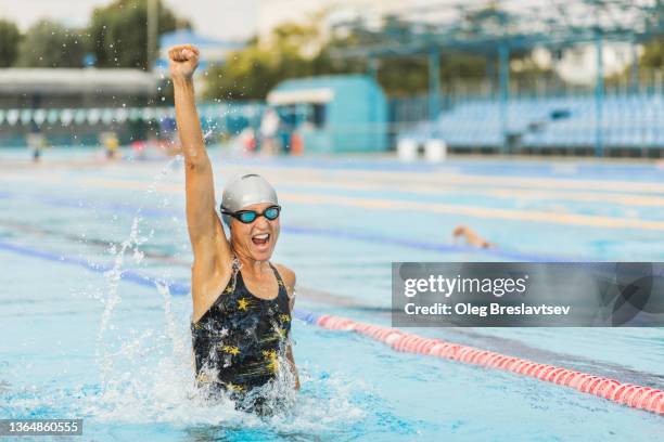 emotions of winner woman in swimming competition. goal achievement, win. - action face stock pictures, royalty-free photos & images