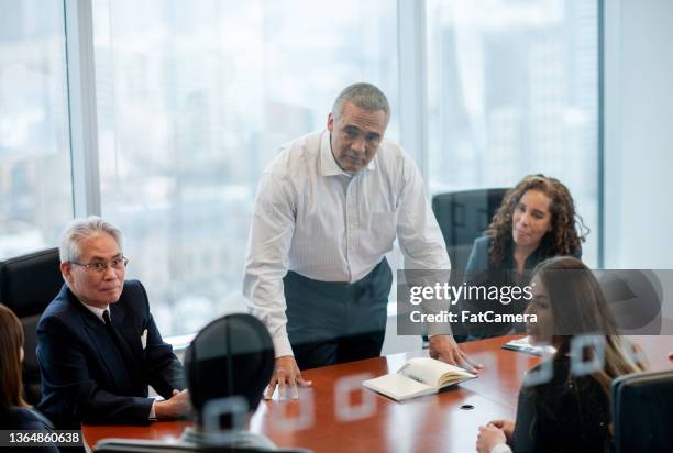 presenting at a business meeting - islamic finance stock pictures, royalty-free photos & images