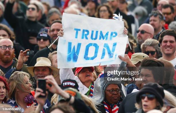 Supporter holds a 'Trump Won' sign at a rally by former President Donald Trump at the Canyon Moon Ranch festival grounds on January 15, 2022 in...