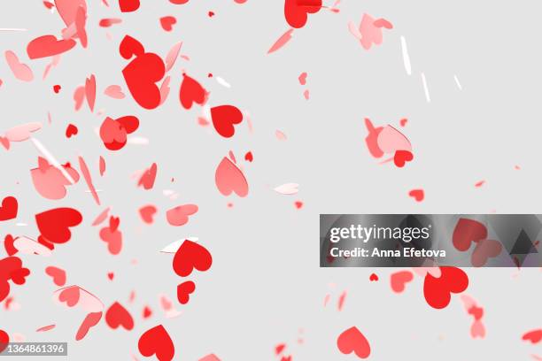 many red valentine's day hearts falling on white background. holiday backdrop for your design. three dimensional illustration - falling in love stockfoto's en -beelden