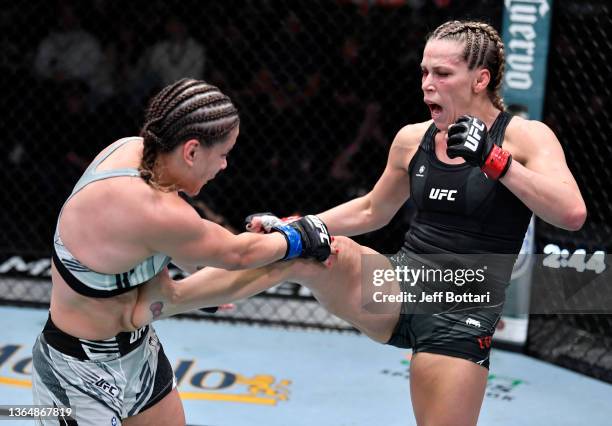 Katlyn Chookagian kicks Jennifer Maia of Brazil in their lightweight fight during the UFC Fight Night event at UFC APEX on January 15, 2022 in Las...