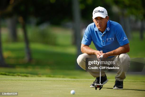 Charles Howell III of the United States lines up his putt on the 13th green during the third round of the Sony Open in Hawaii at Waialae Country Club...