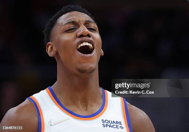 Barrett of the New York Knicks reacts after a dunk by Mitchell Robinson against the Atlanta Hawks during the second half at State Farm Arena on...