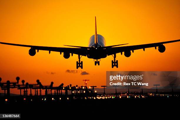 sunset landing - vancouver international airport stock pictures, royalty-free photos & images