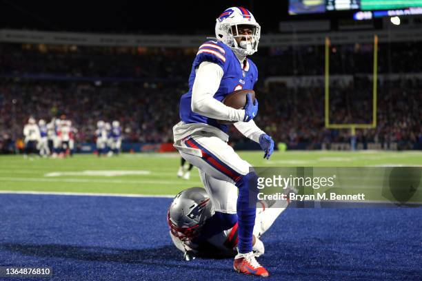 Emmanuel Sanders of the Buffalo Bills scores a touchdown against Joejuan Williams of the New England Patriots during the third quarter in the AFC...