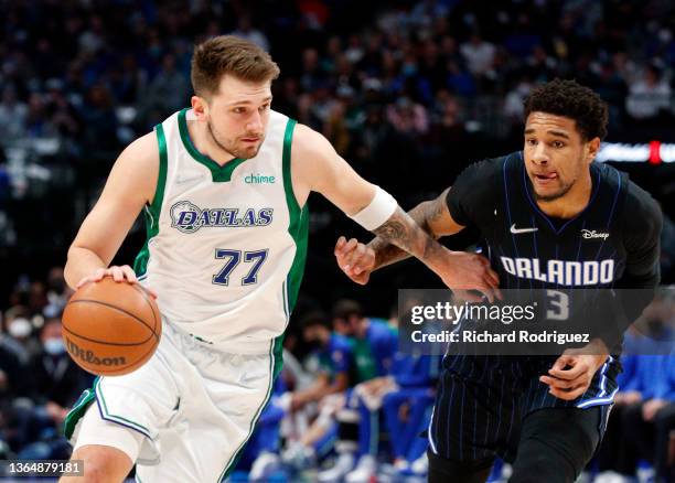 Luka Doncic of the Dallas Mavericks drives the ball past Chuma Okeke of the Orlando Magic in the first half at American Airlines Center on January...