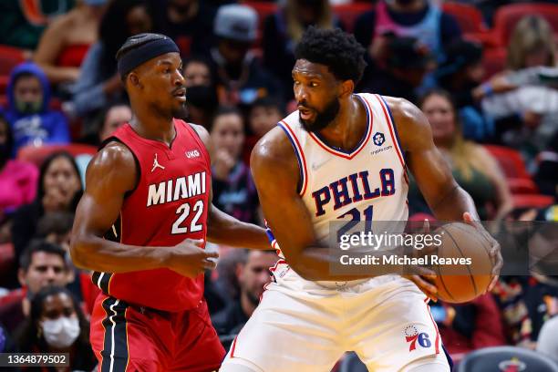 Joel Embiid of the Philadelphia 76ers is defended by Jimmy Butler of the Miami Heat during the second half at FTX Arena on January 15, 2022 in Miami,...